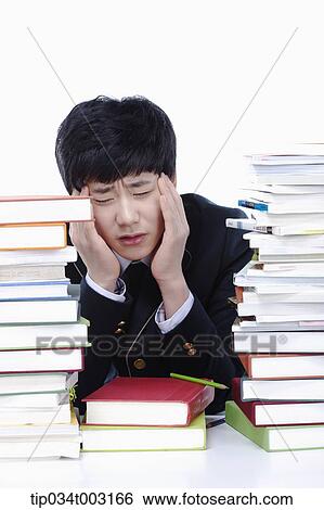 schoolboy having a headache View Large Photo Image Stock Photograph - schoolboy having a headache. Fotosearch