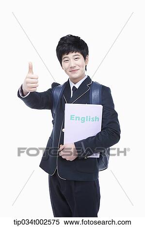 Stock Photography - schoolboy holding a folder and giving a thumbs-up. Fotosearch