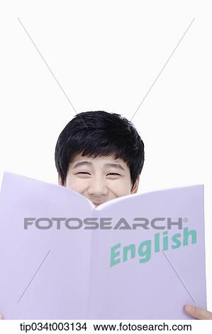 Picture - schoolboy reading a book . Fotosearch