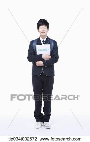 schoolboy standing and holding a folder View Large Photo Image Stock Image - schoolboy standing and holding a folder. Fotosearch