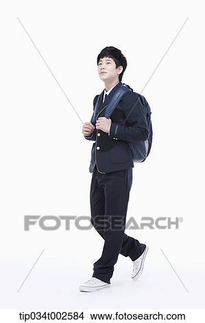 schoolboy wearing a schoolbag and walking forward View Large Photo Image Picture - schoolboy wearing a schoolbag and walking forward. Fotosearch