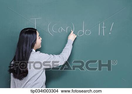 schoolgirl filling out the bracket on the blackboard View Large Photo Image Picture - schoolgirl filling out the bracket on the blackboard. Fotosearch