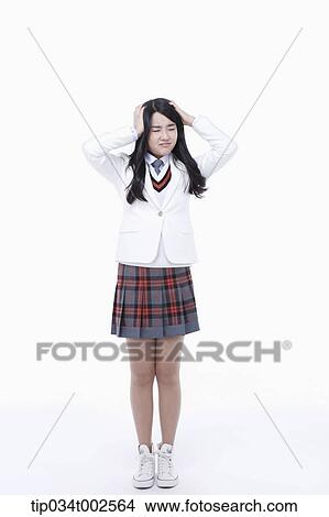 schoolgirl having a headache View Large Photo Image Picture - schoolgirl having a headache. Fotosearch