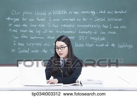 schoolgirl studying hard in front of the blackboard with computer View Large Photo Image Stock Image - schoolgirl studying hard in front of the blackboard with computer. Fotosearch