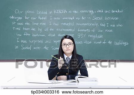 schoolgirl studying hard in front of the blackboard with computer View Large Photo Image Stock Photograph - schoolgirl studying hard in front of the blackboard with computer. Fotosearch