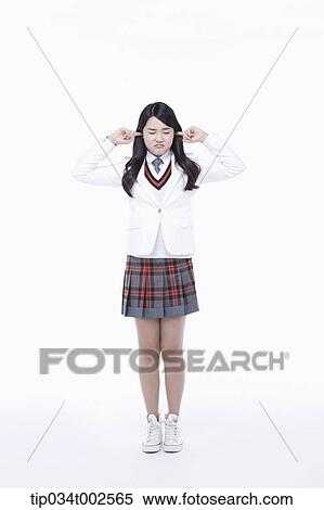 Stock Photography - schoolgirl trying not to listen. Fotosearch