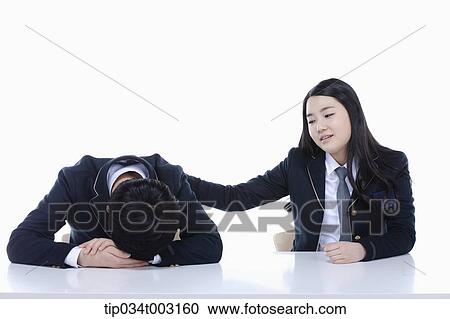 Stock Image - schoolgirl waking up schoolboy . Fotosearch