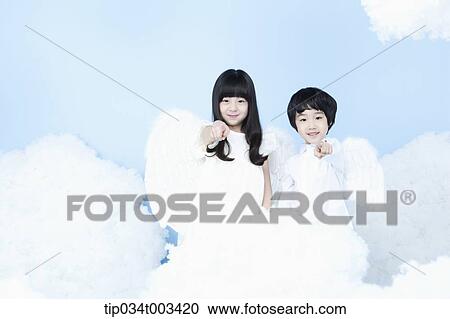 two kids with looks of angels on the clouds View Large Photo Image Stock Image - two kids with looks of angels on the clouds. Fotosearch
