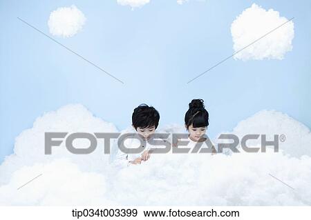 two kids with looks of angels on the clouds View Large Photo Image Stock Photo - two kids with looks of angels on the clouds. Fotosearch