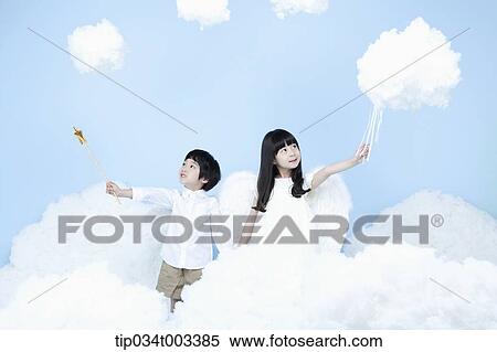 two kids with looks of angels on the clouds View Large Photo Image Stock Photography - two kids with looks of angels on the clouds. Fotosearch