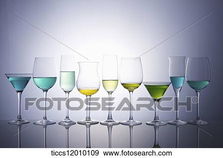 Stock Photo - Wine glasses in different size and shape filled with colorful cocktails. Fotosearch