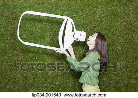 Stock Photo - woman drinking water in the bottle. Fotosearch