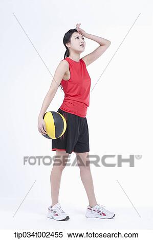 Stock Photography - woman holding a beach ball . Fotosearch