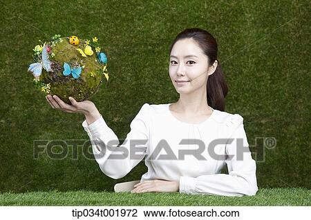 woman holding a sphere covered with colorful butterflies View Large Photo Image Stock Image - woman holding a sphere covered with colorful butterflies . Fotosearch