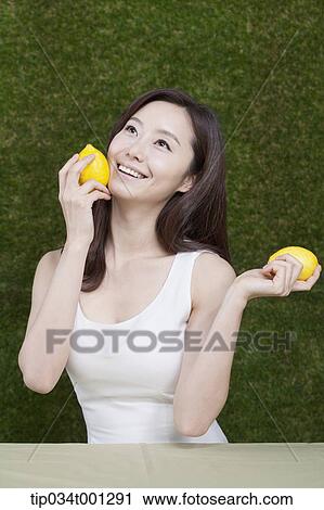 woman holding lemon on her hands View Large Photo Image Stock Image - woman holding lemon on her hands . Fotosearch