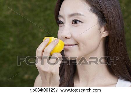 woman holding lemon on her hands View Large Photo Image Stock Photo - woman holding lemon on her hands . Fotosearch