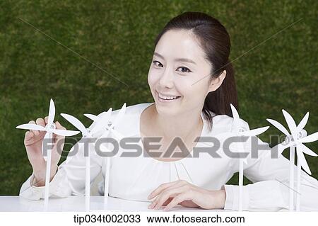 woman playing with pinwheels on the table View Large Photo Image Stock Image - woman playing with pinwheels on the table. Fotosearch