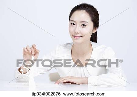 Stock Photograph - woman touching the white tree model. Fotosearch