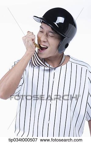 A baseball player biting gold medal View Large Photo Image Stock Photo - A baseball player biting gold medal. Fotosearch