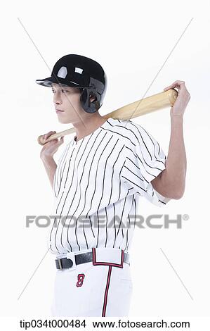 Picture - A baseball player putting the bat on his back. Fotosearch