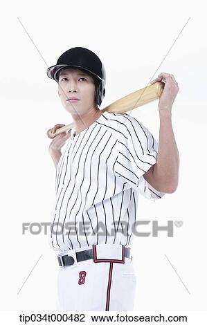 A baseball player putting the bat on his back View Large Photo Image Stock Image - A baseball player putting the bat on his back. Fotosearch