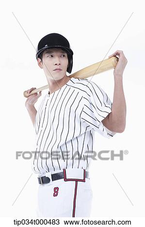 Stock Image - A baseball player putting the bat on his back. Fotosearch
