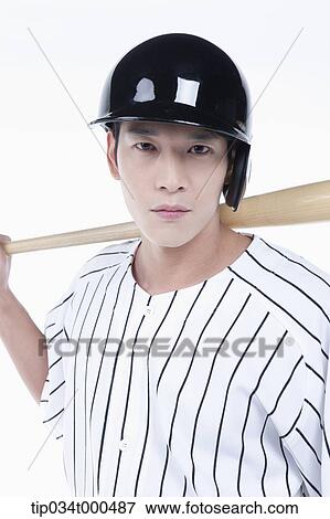 Stock Photo - A baseball player putting the bat on his back. Fotosearch