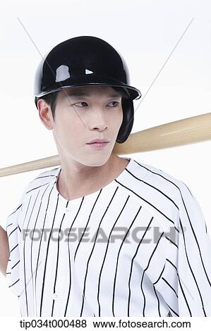 A baseball player putting the bat on his back View Large Photo Image Stock Photo - A baseball player putting the bat on his back. Fotosearch