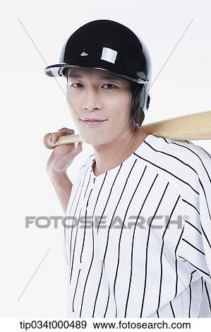 Stock Photo - A baseball player putting the bat on his back. Fotosearch