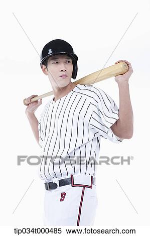 Stock Photography - A baseball player putting the bat on his back. Fotosearch