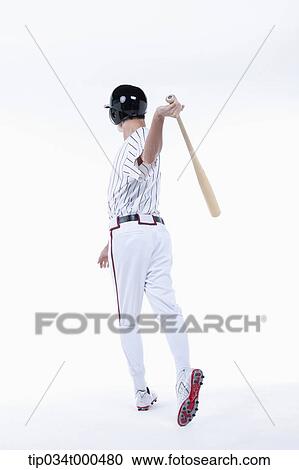 Stock Image - A baseball player swing the bat. Fotosearch