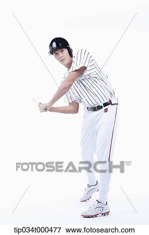 Stock Photo - A baseball player swing the bat. Fotosearch