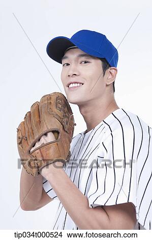 Picture - A baseball player wearing a glove. Fotosearch
