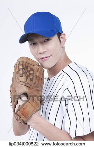 Stock Image - A baseball player wearing a glove. Fotosearch