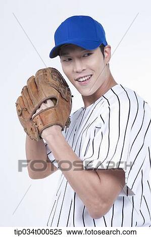 A baseball player wearing a glove View Large Photo Image Stock Photography - A baseball player wearing a glove. Fotosearch