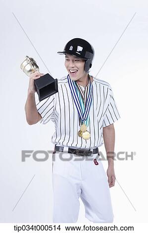 A baseball player with gold medals and trophy View Large Photo Image Picture - A baseball player with gold medals and trophy. Fotosearch