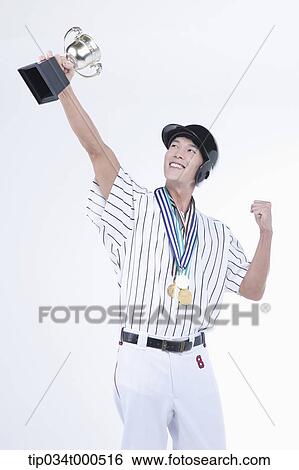 A baseball player with gold medals and trophy View Large Photo Image Stock Photograph - A baseball player with gold medals and trophy. Fotosearch