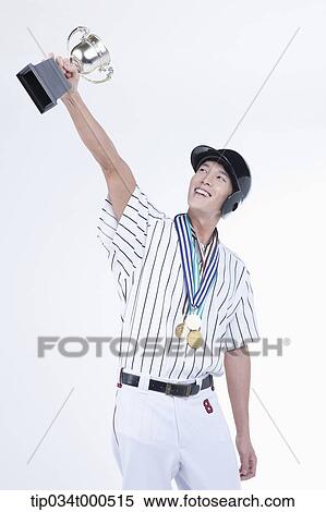 A baseball player with gold medals and trophy View Large Photo Image Stock Photography - A baseball player with gold medals and trophy. Fotosearch
