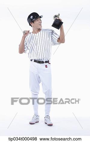 A baseball player with gold trophy View Large Photo Image Stock Photo - A baseball player with gold trophy. Fotosearch