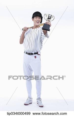 A baseball player with gold trophy View Large Photo Image Stock Photo - A baseball player with gold trophy. Fotosearch