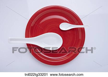 A big and small spoon on the dish View Large Photo Image Stock Image - A big and small spoon on the dish . Fotosearch