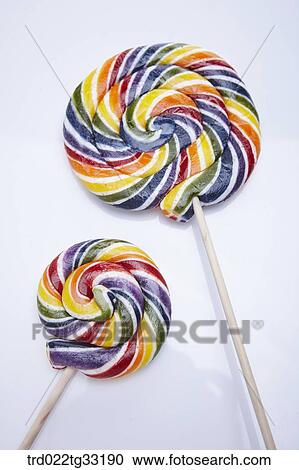 Stock Image - A big candy and a small candy. Fotosearch