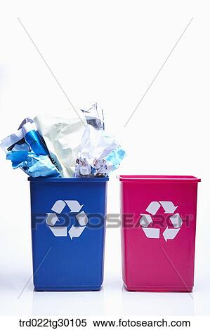 A blue trash basket full of paper trash and another red trash basket being empty View Large Photo Image Stock Photography - A blue trash basket full of paper trash and another red trash basket being empty . Fotosearch