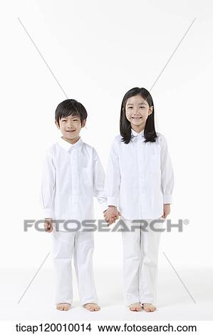 A boy and girl holding hands together View Large Photo Image Picture - A boy and girl holding hands together. Fotosearch