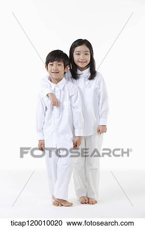 A boy and girl putting arms around on View Large Photo Image Stock Image - A boy and girl putting arms around on. Fotosearch