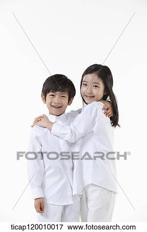 A boy and girl putting arms around on View Large Photo Image Stock Photo - A boy and girl putting arms around on. Fotosearch