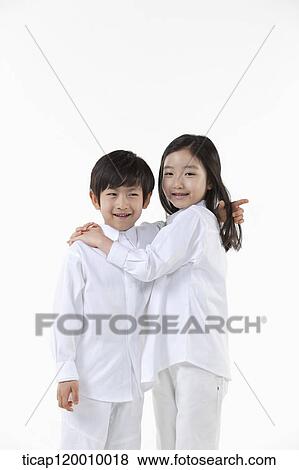 A boy and girl putting arms around on View Large Photo Image Stock Photo - A boy and girl putting arms around on. Fotosearch