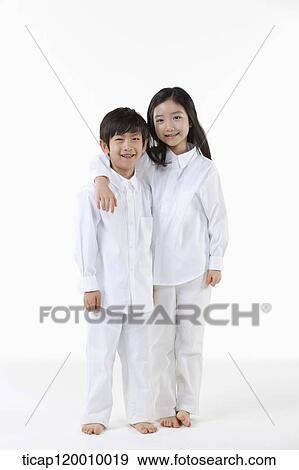 A boy and girl putting arms around on View Large Photo Image Stock Photo - A boy and girl putting arms around on. Fotosearch