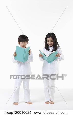 A boy and girl reading a book View Large Photo Image Stock Photography - A boy and girl reading a book. Fotosearch