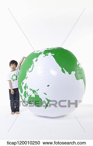 A boy in recycling shirt and a green globe View Large Photo Image Stock Image - A boy in recycling shirt and a green globe. Fotosearch